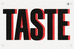 Perkataan TASTE dicetak besar dalam dakwat hitam bertindan merah atas kertas putih, kesan cetak tersasar sikit.